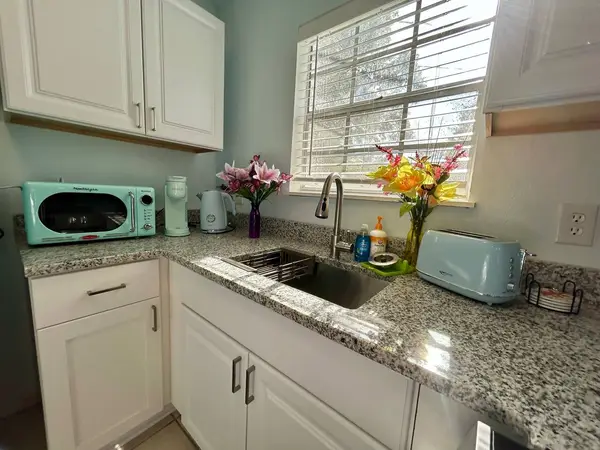 Kitchen counter with a sink and microwave