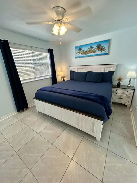 Bedroom with a king bed and a bright window
