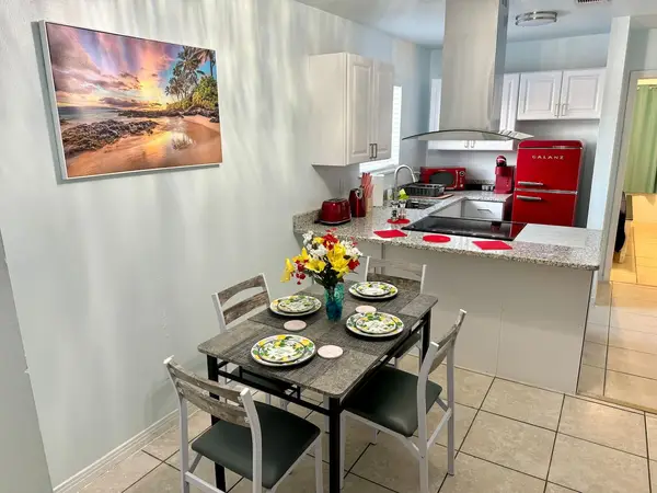 Dining table for four beside the kitchen