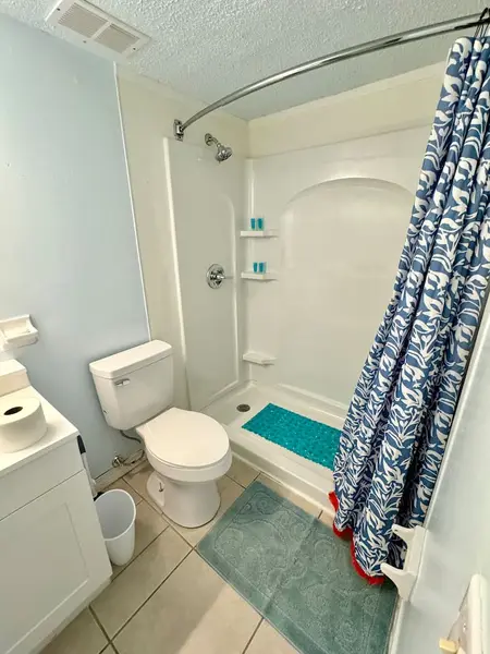 Bathroom with a shower and toilet