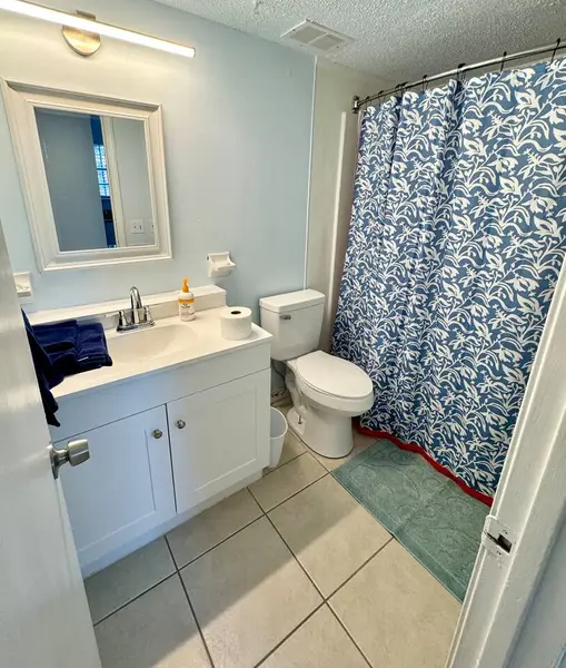 Bathroom with a vanity and mirror