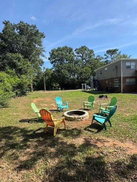 Fire pit with chairs on the shared lawn