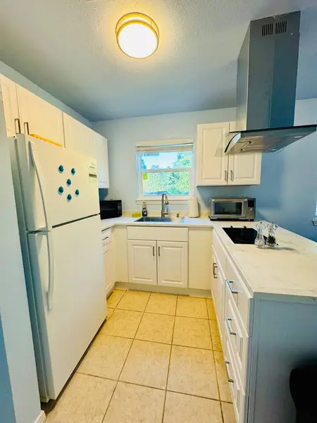 Kitchen with a fridge and plenty of counter space