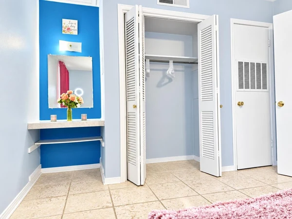Vanity nook beside an open closet in the bedroom