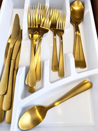 Gold flatware in the kitchen drawer