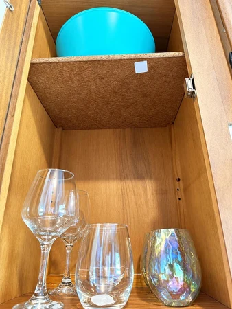 Wine glasses in a kitchen cabinet