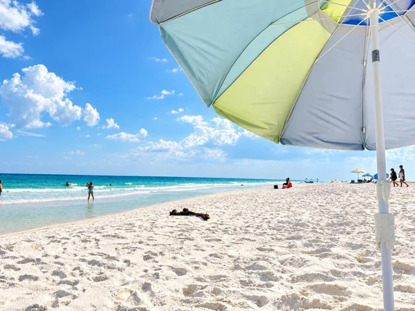 Pensacola Beach seen from under a beach umbrella
