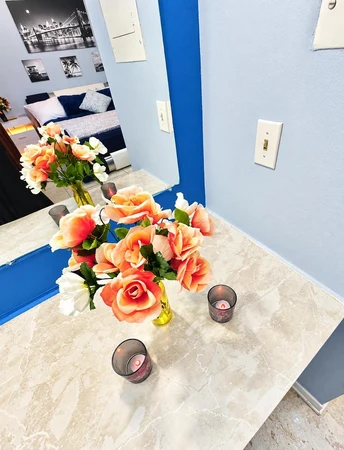 Vanity with roses, looking into the bedroom