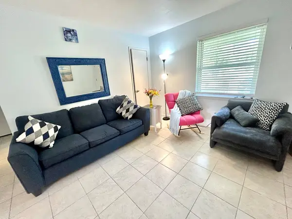 Living room with two sofas and an armchair