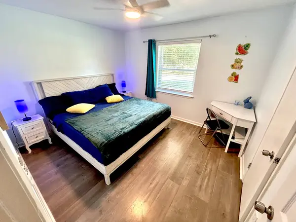 Bedroom with a king bed and a workspace