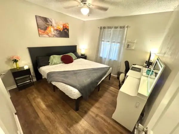 Bedroom with a king bed and a desk