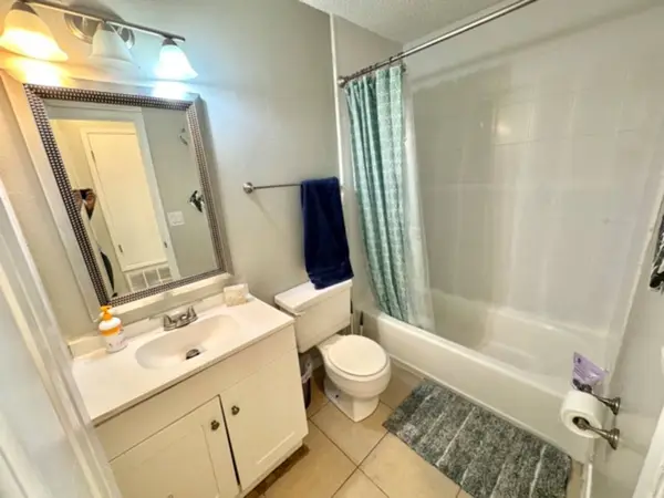 Bathroom with a shower over the bath